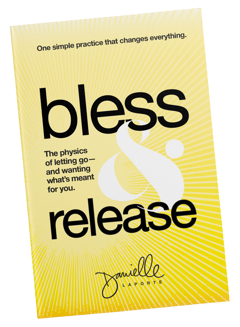 A yellow book cover with the title "bless & release" in large black text, and the subtitle "The physics of letting go—and wanting what’s meant for you." by Danielle Laporte. The background has white radial lines.